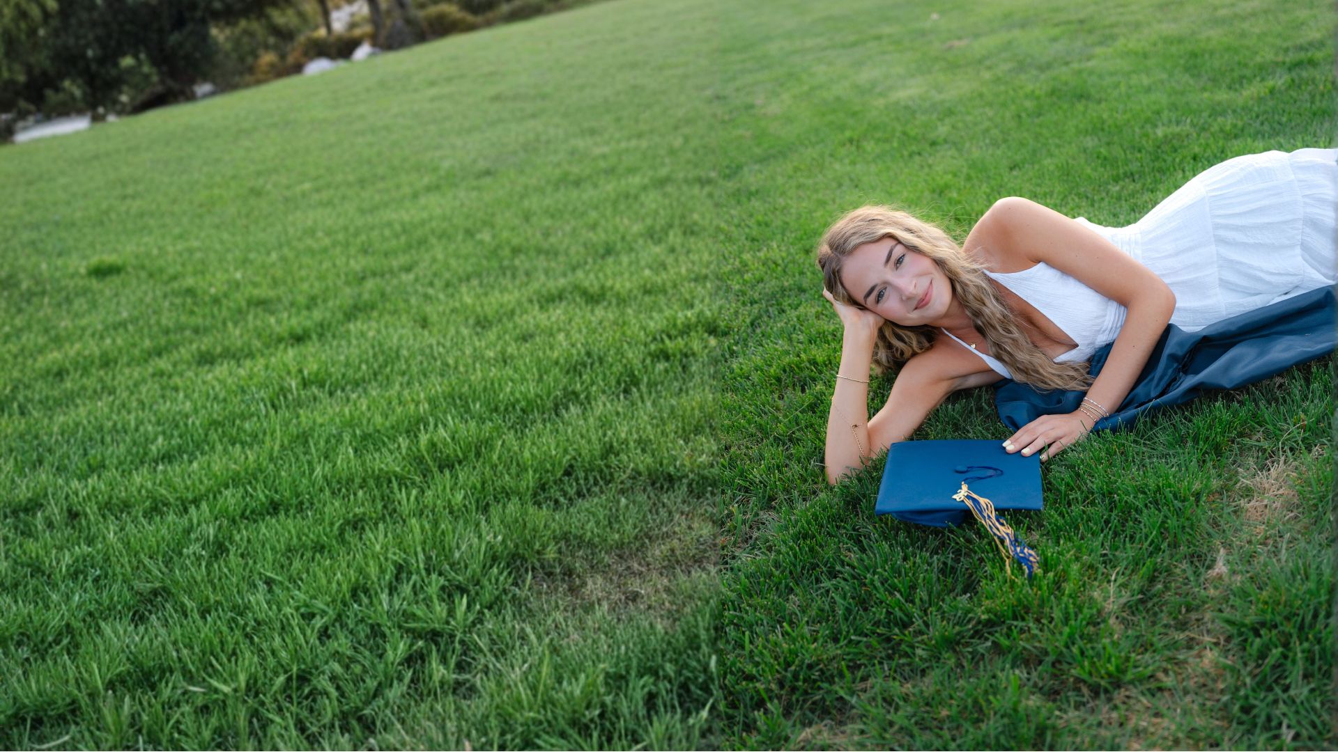 Skylar Mitchel in a graduation gown resting on a green lawn with her cap beside her